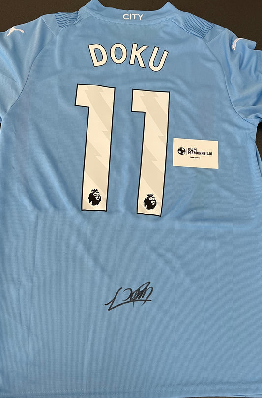 Jeremy Doku signed shirt.